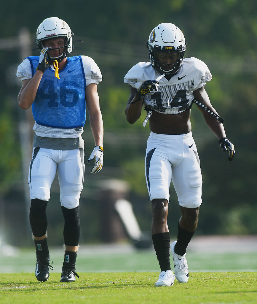 Jacob Trump and Adam Sparks walk back after a drill